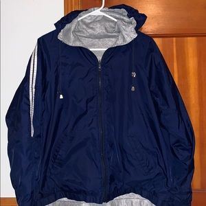 blue hooded windbreaker jacket with grey interior